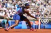 Coco Gauff of United States returns the ball against Maria Lourdes Carle of Argentina during the women's singles tennis competition at the at the Roland Garros stadium, at the 2024 Summer Olympics, Monday, July 29, 2024, in Paris, France. (AP Photo/Manu Fernandez)