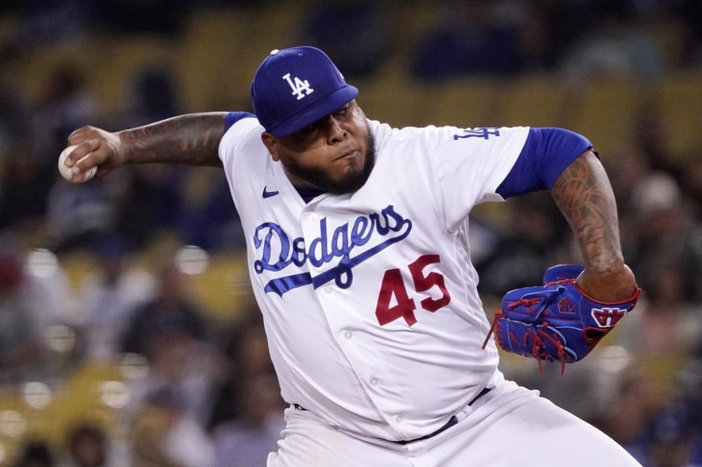 FILE - Los Angeles Dodgers relief pitcher Reyes Moronta throws to the plate during the ninth inning of a baseball game against the San Francisco Giants, May 4, 2022, in Los Angeles. Moronta died on July 28, 2024, in a traffic accident in his native province of Santiago, Dominican Republic, according to his former Dominican team the Águilas Cibaeñas. (AP Photo/Mark J. Terrill, File)