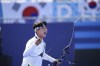 South Korea's Wooseok Lee celebrates winning during the men's team semifinals Archery competition against China at the 2024 Summer Olympics, Monday, July 29, 2024, in Paris, France. (AP Photo/Rebecca Blackwell)