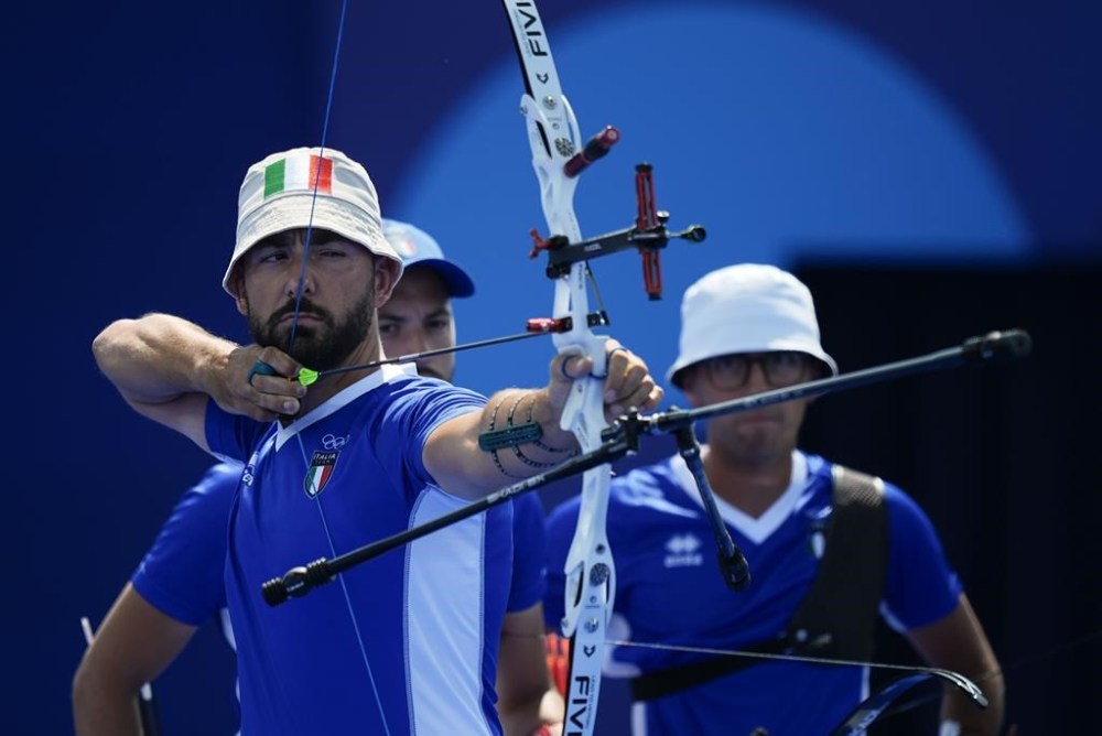 Italy's Mauro Nespoli shoots during the men's team quarterfinals Archery competition against France at the 2024 Summer Olympics, Monday, July 29, 2024, in Paris, France. (AP Photo/Rebecca Blackwell)