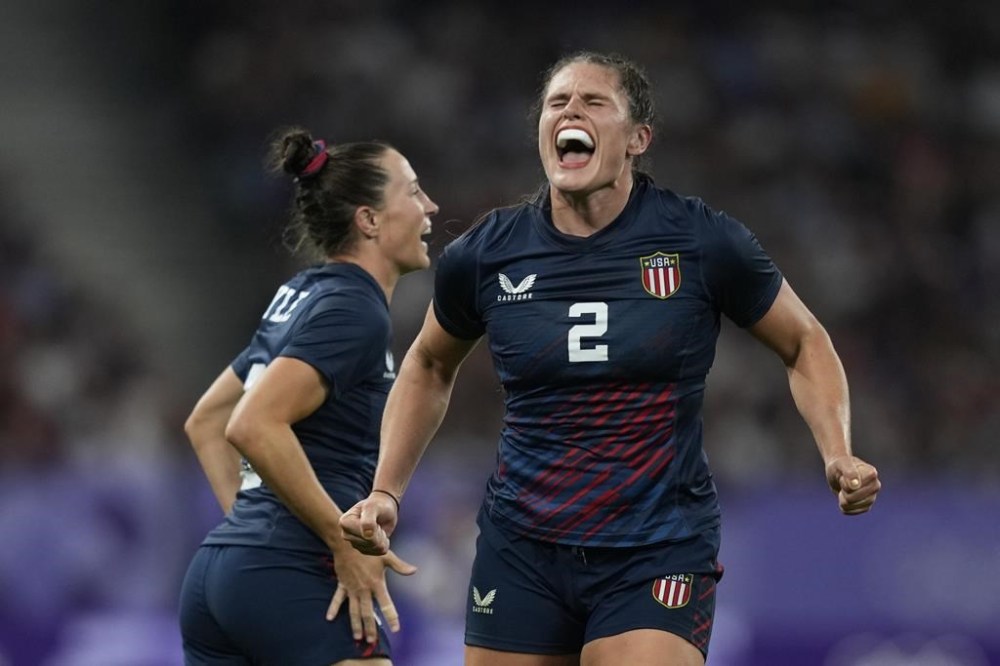 United States' Ilona Maher celebrates after winning their women's quarterfinal Rugby Sevens match between Great Britain and the United States at the 2024 Summer Olympics, in the Stade de France, in Saint-Denis, France, Monday, July 29, 2024. (AP Photo/Tsvangirayi Mukwazhi)