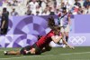 Canada's Piper Logan dives over the line to score a try during the women's Pool A Rugby Sevens match between Canada and China at the 2024 Summer Olympics, in the Stade de France, in Saint-Denis, France, Monday, July 29, 2024. THE CANADIAN PRESS/AP-Tsvangirayi Mukwazhi