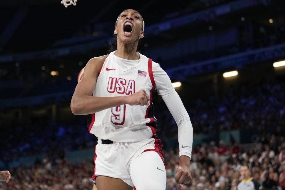 A'ja Wilson, of the Unites States, celebrates after scoring against Japan in a women's basketball game at the 2024 Summer Olympics, Monday, July 29, 2024, in Villeneuve-d'Ascq, France. (AP Photo/Mark J. Terrill)