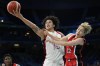 Brittney Griner, of the Unites States, shoots over Saori Miyazaki, of Japan, in a women's basketball game at the 2024 Summer Olympics, Monday, July 29, 2024, in Villeneuve-d'Ascq, France. (AP Photo/Mark J. Terrill)