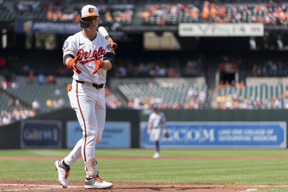 Baltimore Orioles' Gunnar Henderson throws his bat on a walk by Toronto Blue Jays starting pitcher Yariel Rodriguez during the first inning in the first baseball game of a doubleheader, Monday, July 29, 2024, in Baltimore. (AP Photo/Stephanie Scarbrough)