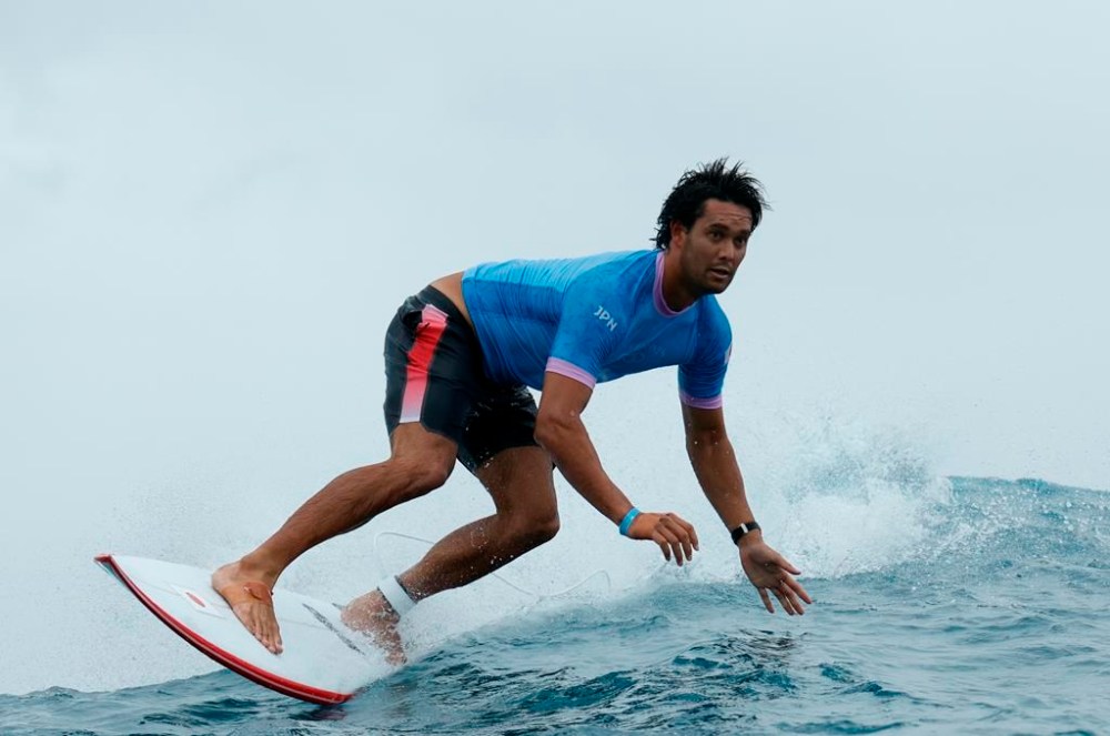 Japan's Connor O'leary exits a wave in the 8th heat during round three of the surfing competition, on day three at the 2024 Summer Olympics, Monday, July 29, 2024, in Teahupo'o, French Polynesia. (Ben Thouard/Pool Photo via AP)