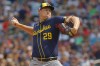 Milwaukee Brewers relief pitcher Trevor Megill throws to the Minnesota Twins in the ninth inning of a baseball game Sunday, July 21, 2024, in Minneapolis. (AP Photo/Bruce Kluckhohn)