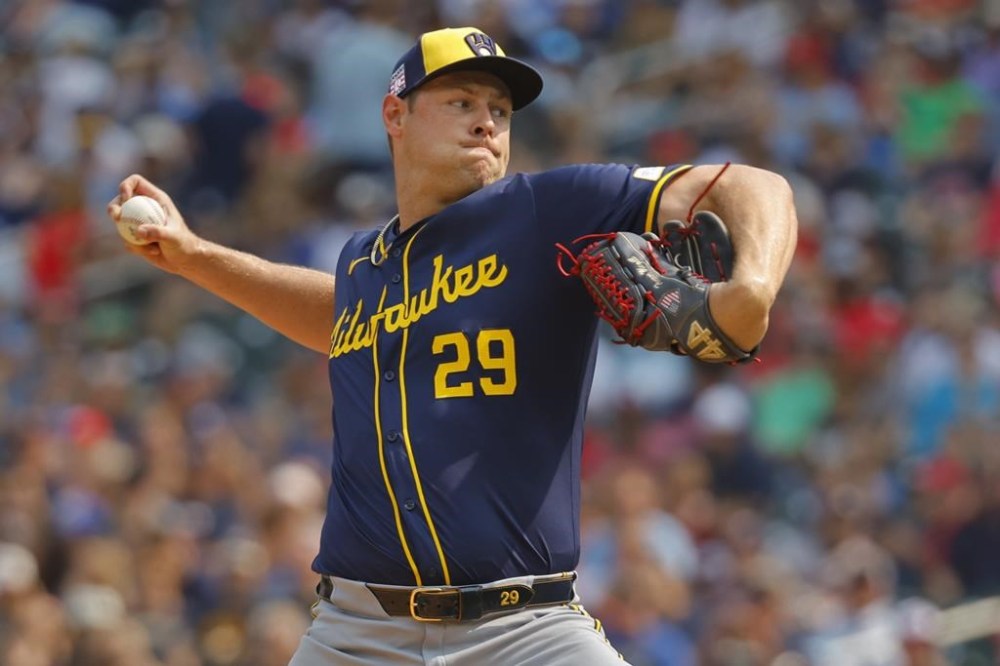 Milwaukee Brewers relief pitcher Trevor Megill throws to the Minnesota Twins in the ninth inning of a baseball game Sunday, July 21, 2024, in Minneapolis. (AP Photo/Bruce Kluckhohn)