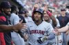 Cleveland Guardians' Jose Ramírez is greeted in the dugout after a solo home run during the seventh inning of a baseball game against the Detroit Tigers, Monday, July 29, 2024, in Detroit. (AP Photo/Carlos Osorio)