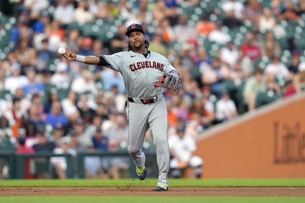 Cleveland Guardians third baseman Jose Ramírez throws out Detroit Tigers' Mark Canha at first during the fifth nning of a baseball game, Monday, July 29, 2024, in Detroit. (AP Photo/Carlos Osorio)