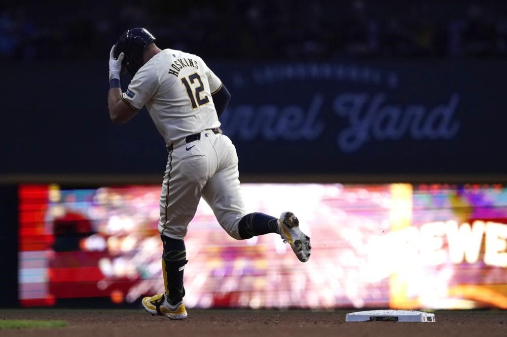Milwaukee Brewers' Rhys Hoskins rounds the bases after hitting a solo home run during the fifth inning of a baseball game against the Atlanta Braves, Monday, July 29, 2024, in Milwaukee. (AP Photo/Aaron Gash)