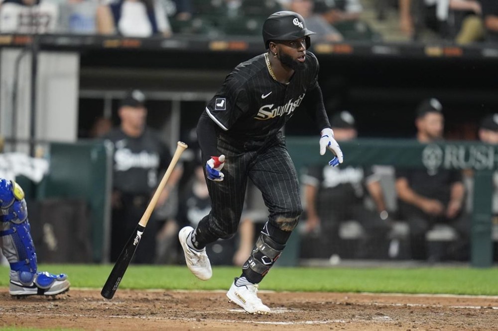 Chicago White Sox's Luis Robert Jr. starts to run to first after hitting a single during the fifth inning of a baseball game against the Kansas City Royals, Monday, July 29, 2024, in Chicago. (AP Photo/Erin Hooley)