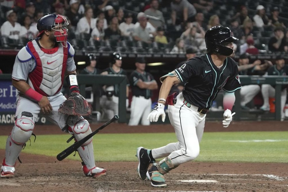 Arizona Diamondbacks' Corbin Carroll hits a two-run walk-off home run to defeat the Washington Nationals during a baseball game, Monday, July 29, 2024, in Phoenix. (AP Photo/Rick Scuteri)