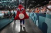 The Olympics 2024 mascot walks at the South Paris Arena during the women's handball matches at the 2024 Summer Olympics, Thursday, July 25, 2024, in Paris, France. (AP Photo/Aaron Favila)