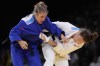 Canada's Catherine Beauchemin-Pinard and Slovenia's Andreja Leski, left, compete during their women -63kg quarterfinal match in team judo competition at Champ-de-Mars Arena during the 2024 Summer Olympics, Tuesday, July 30, 2024, in Paris, France. THE CANADIAN PRESS/AP/Eugene Hoshiko