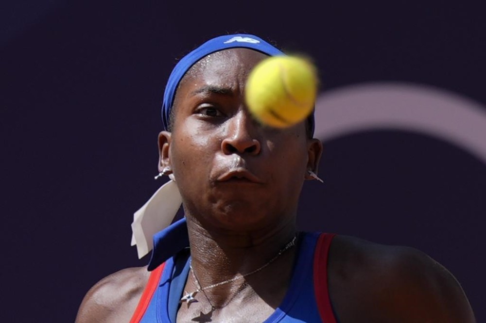 Coco Gauff of United States eyes on the ball as she plays against Donna Vekic of Croatiathe during their women's singles third round match at the Roland Garros stadium, at the 2024 Summer Olympics, Tuesday, July 30, 2024, in Paris, France. (AP Photo/Andy Wong)