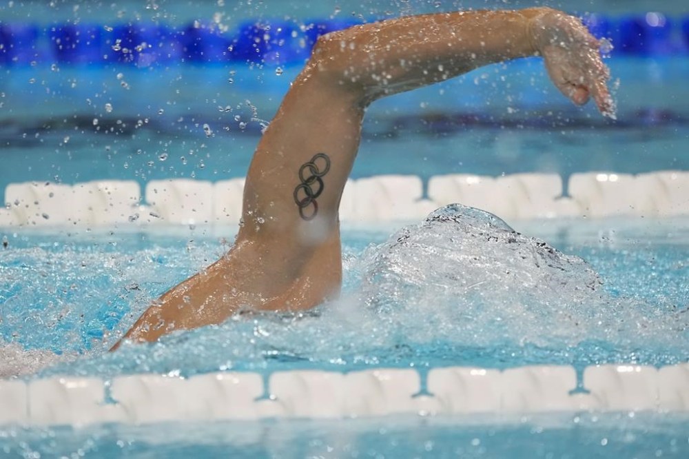 Blake Pieroni, of the United States, competes in the men's 4 x 200-meter freestyle relay at the 2024 Summer Olympics, Tuesday, July 30, 2024, in Nanterre, France. (AP Photo/Ashley Landis)