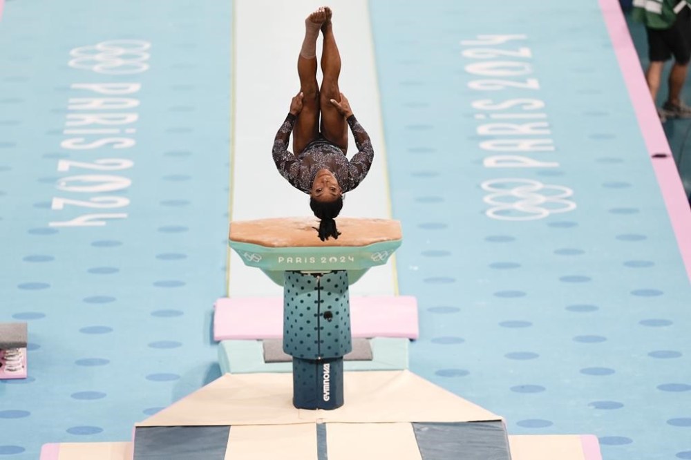 Simone Biles, of United States, competes on the vault during a women's artistic gymnastics qualification round at Bercy Arena at the 2024 Summer Olympics, Sunday, July 28, 2024, in Paris, France. (AP Photo/Francisco Seco)