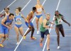FILE - Rhasidat Adeleke, of Ireland, right, hands the baton to teammate Thomas Barr in the 4 X 400 meters relay mixed final at the European Athletics Championships in Rome, June 7, 2024. (AP Photo/Gregorio Borgia, File)