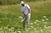 Jon Rahm, of Spain, chips onto the sixth green during a practice round for the men's golf event at the 2024 Summer Olympics, Tuesday, July 30, 2024, at Le Golf National in Saint-Quentin-en-Yvelines, France. (AP Photo/Matt York)