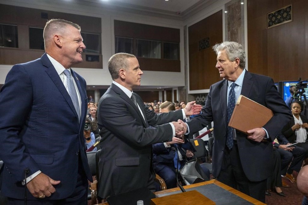 Sen. John Kennedy, R-La. meets with FBI Deputy Director Paul Abbate, center, and U.S. Secret Service Acting Director Ronald Rowe, left, before they testify before a Joint Senate Committee on Homeland Security and Governmental Affairs and Senate Committee on the Judiciary hearing examining the security failures leading to the assassination attempt on Republican presidential candidate former President Donald Trump, Tuesday, July 30, 2024 in Washington. (AP Photo/Kevin Wolf)