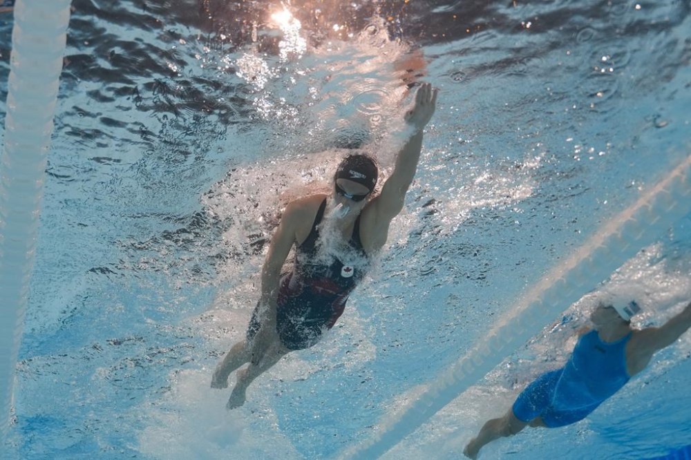 Summer McIntosh, of Canada, competes during a heat in the women's 400-meter freestyle at the 2024 Summer Olympics, Saturday, July 27, 2024, in Nanterre, France. (AP Photo/David J. Phillip)