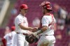 Cincinnati Reds' Lucas Sims, left, celebrates with Austin Wynns, right, after their victory over the Colorado Rockies in a baseball game, Thursday, July 11, 2024, in Cincinnati. (AP Photo/Jeff Dean)