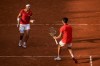 Carlos Alcaraz, right, and Rafael Nadal of Spain celebrate a point against Tallon Griekspoor and Wesley Koolhof of the Netherlands during the men's doubles tennis competition at the Roland Garros stadium, at the 2024 Summer Olympics, Tuesday, July 30, 2024, in Paris, France. (AP Photo/Manu Fernandez)