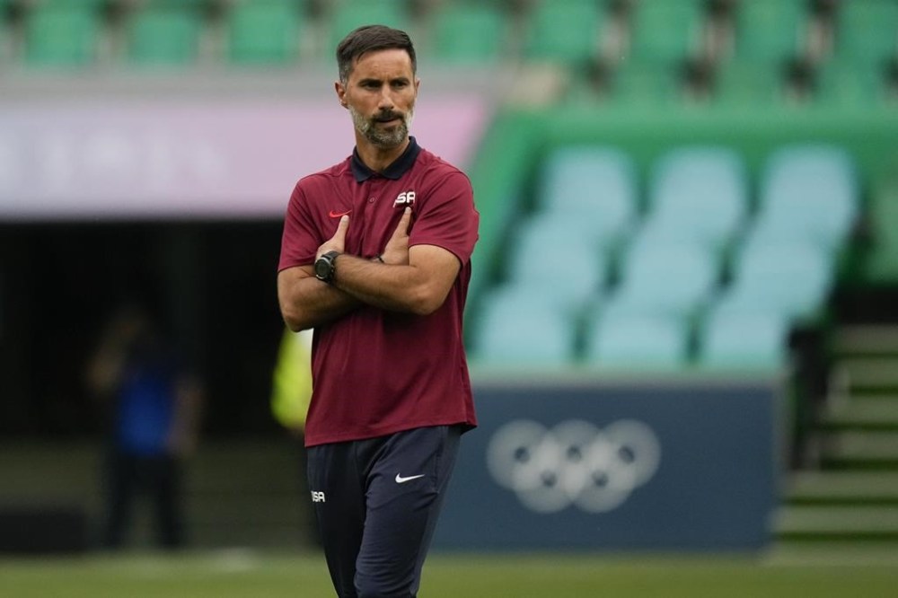 United States' head coach Marko Mitrovic stands on the pitch prior to the men's Group A soccer match between United States and Guinea, at Geoffroy-Guichard Stadium, during the 2024 Summer Olympics, Tuesday, July 30, 2024, in Saint-Etienne, France. (AP Photo/Silvia Izquierdo)