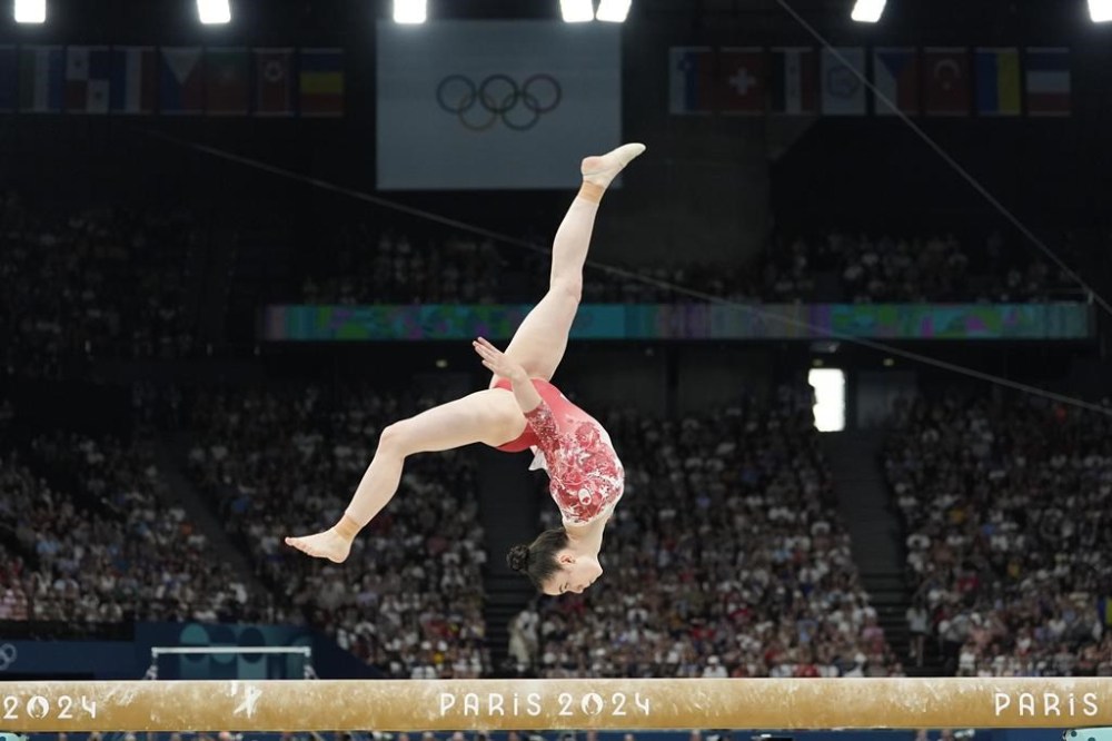 Ava Stewart, of Canada, performs on the balance beam during the women's artistic gymnastics team finals round at Bercy Arena at the 2024 Summer Olympics, Tuesday, July 30, 2024, in Paris, France. THE CANADIAN PRESS/AP, Abbie Parr