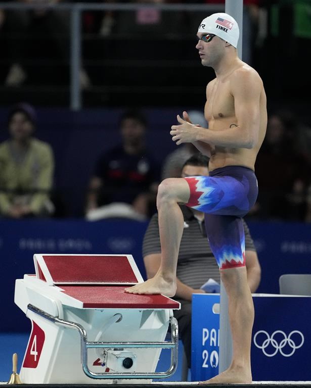 Bobby Finke, of the United States, prepares to start in his heat of the men's 800-meter freestyle at the 2024 Summer Olympics, Monday, July 29, 2024, in Nanterre, France. (AP Photo/Matthias Schrader)