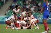 Canada's players celebrate after Vanessa Gilles, bottom center, scored her side's second goal during the women's Group A soccer match between Canada and France at Geoffroy-Guichard stadium during the 2024 Summer Olympics, Sunday, July 28, 2024, in Saint-Etienne, France. (AP Photo/Silvia Izquierdo)