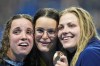 Gold medalist Kaylee McKeown, of Australia, center, poses with silver medalist Regan Smith, of the United States, left, as bronze medalist Katharine Berkoff, of the United States, following the women's 100-meter backstroke final at the 2024 Summer Olympics, Tuesday, July 30, 2024, in Nanterre, France. (AP Photo/Petr David Josek)