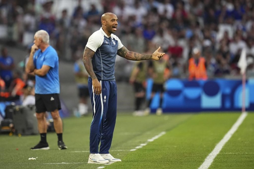 France's head coach Thierry Henry gestures from the sideline during the men's Group A soccer match between New Zealand and France at the Velodrome Stadium, during the 2024 Summer Olympics, Tuesday, July 30, 2024, in Marseille, France. (AP Photo/Daniel Cole)