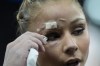 Flavia Saraiva, of Brazil, has an injury after falling during a warm up during the women's artistic gymnastics team finals round at Bercy Arena at the 2024 Summer Olympics, Tuesday, July 30, 2024, in Paris, France. (AP Photo/Francisco Seco)
