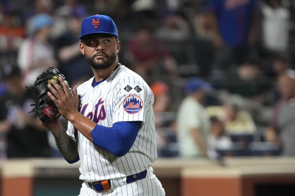 New York Mets pitcher Sean Manaea reacts as he walks to the dugout after striking out Minnesota Twins' Willi Castro during the seventh inning of a baseball game, Tuesday, July 30, 2024, in New York. (AP Photo/Pamela Smith)