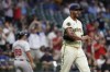 Milwaukee Brewers' Joe Ross reacts after giving up a home run during the fourth inning of a baseball game against the Atlanta Braves, Tuesday, July 30, 2024, in Milwaukee. (AP Photo/Aaron Gash)
