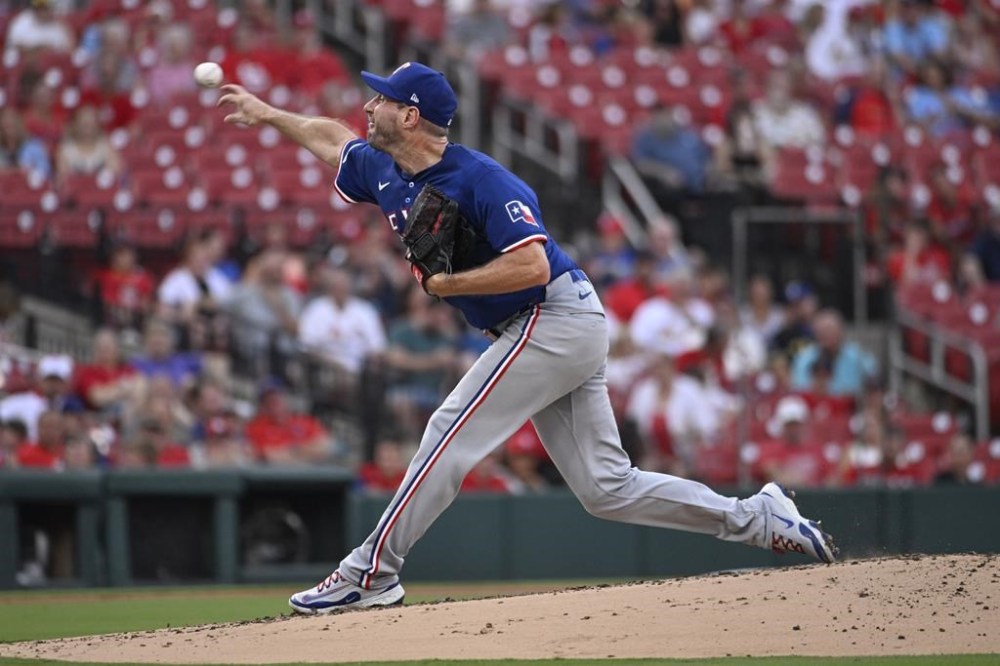 Texas Rangers starting pitcher Max Scherzer throws in the first inning of a baseball game against the St. Louis Cardinals, Tuesday, July 30, 2024, in St. Louis. (AP Photo/Joe Puetz)