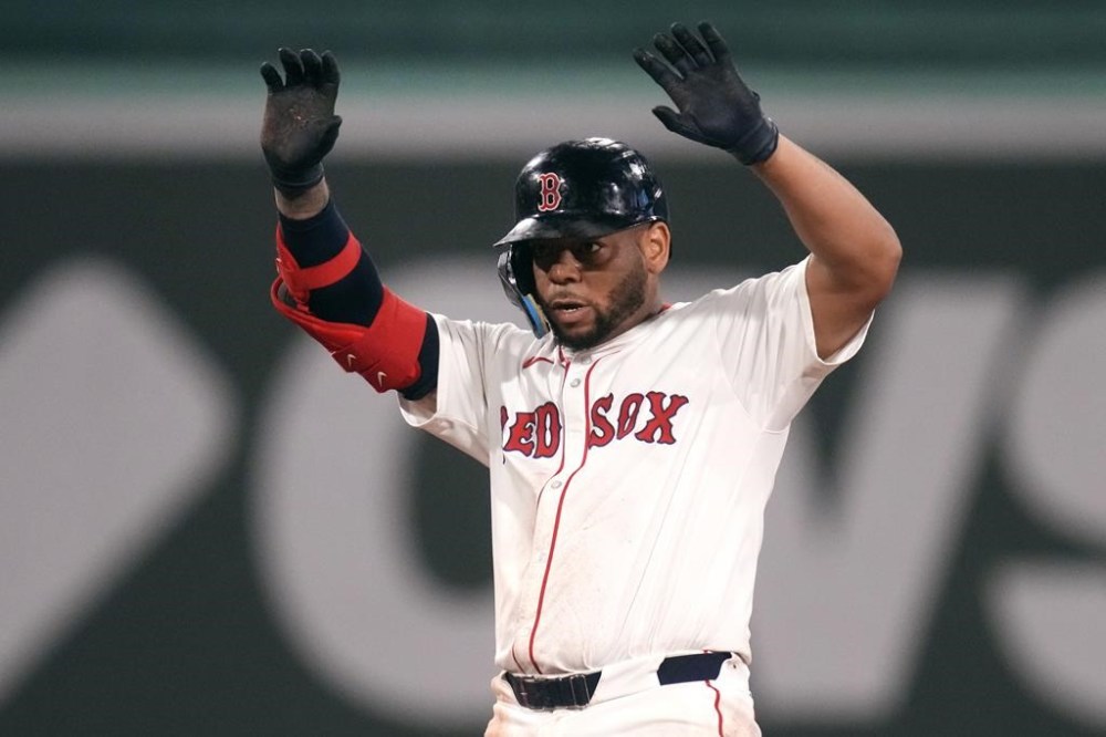 Boston Red Sox's Dominic Smith celebrates after his RBI double during the seventh inning of a baseball game against the Seattle Mariners, Tuesday, July 30, 2024, in Boston. (AP Photo/Charles Krupa)