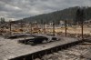 The remains of hotels in Jasper, Alta., on Friday July 26, 2024. The business community of Jasper — a town whose economy depends on tourism, particularly the crucial summer season — is facing an overwhelming challenge in the months ahead. THE CANADIAN PRESS/Amber Bracken