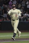 Arizona Diamondbacks third baseman Eugenio Suárez (28) reacts after hitting a two-run home run against the Washington Nationals in the first inning of a baseball game, Tuesday, July 30, 2024, in Phoenix. (AP Photo/Rick Scuteri)