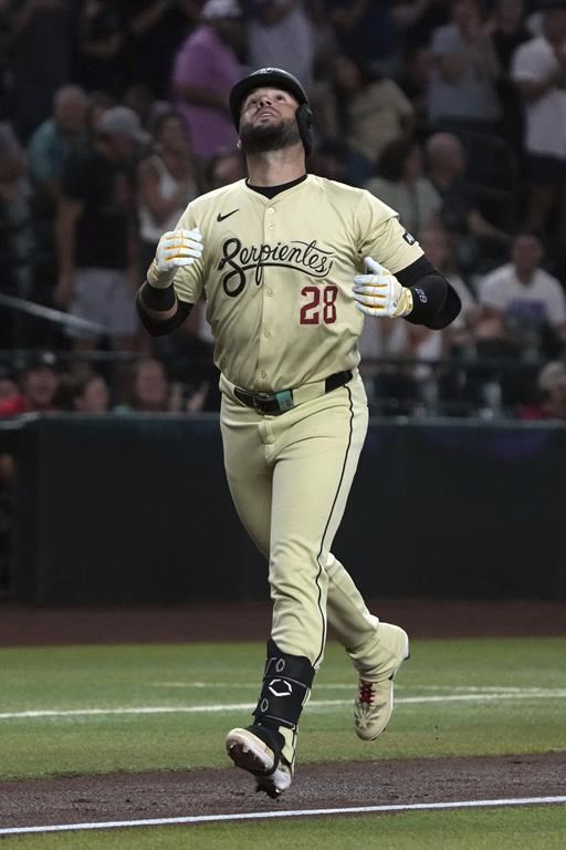 Arizona Diamondbacks third baseman Eugenio Suárez (28) reacts after hitting a two-run home run against the Washington Nationals in the first inning of a baseball game, Tuesday, July 30, 2024, in Phoenix. (AP Photo/Rick Scuteri)