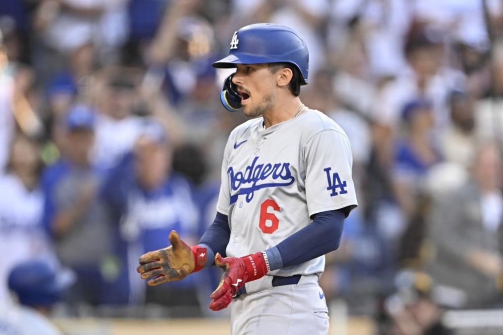 Los Angeles Dodgers second baseman Cavan Biggio (6) celebrates after hitting a solo home run during the first inning of a baseball game against the San Diego Padres, Tuesday, July 30, 2024, in San Diego. (AP Photo/Denis Poroy)