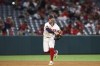 Los Angeles Angels shortstop Zach Neto throws to first base during the ninth inning of a baseball game against the Colorado Rockies in Anaheim, Calif., Tuesday, July 30, 2024. (AP Photo/Jessie Alcheh)