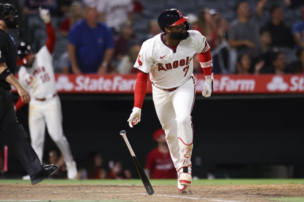 Los Angeles Angels' Jo Adell (7) drops his bat after hitting a home run against the Colorado Rockies during the seventh inning of a baseball game in Anaheim, Calif., Tuesday, July 30, 2024. (AP Photo/Jessie Alcheh)