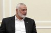 In this photo released by the Iranian Presidency Office, Hamas chief Ismail Haniyeh sits in a meeting with President Masoud Pezeshkian at the presidency office in Tehran, Iran, Tuesday, July 30, 2024. (Iranian Presidency Office via AP)