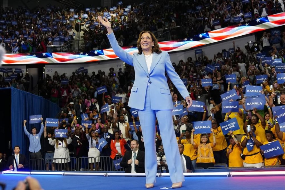 Vice President Kamala Harris waves during a campaign rally, Tuesday, July 30, 2024, in Atlanta. (AP Photo/John Bazemore)