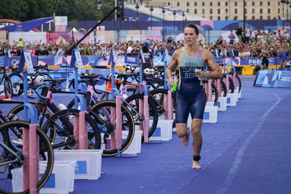 Flora Duffy, of Bermuda, competes during the women's individual triathlon competition at the 2024 Summer Olympics, Wednesday, July 31, 2024, in Paris, France. (AP Photo/Dar Yasin)