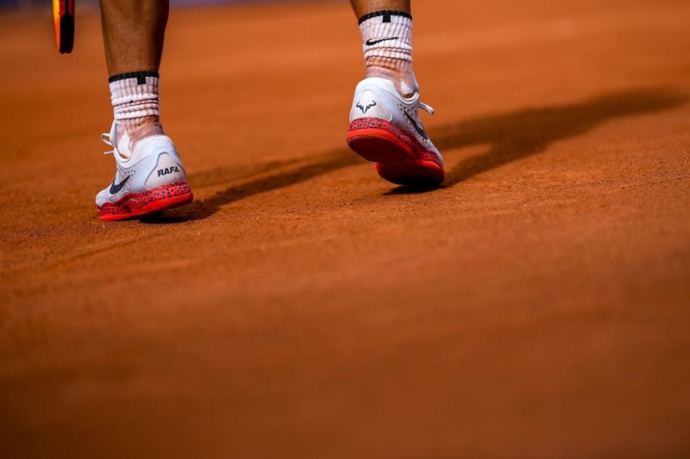 Rafael Nadal of Spain prepares to serve against Marton Fucsovics of Hungary during the men's singles tennis competition, at the 2024 Summer Olympics, Sunday, July 28, 2024, in Paris, France. (AP Photo/Manu Fernandez)