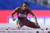FILE - Masai Russell wins a heat women's 100-meter hurdles during the U.S. Track and Field Olympic Team Trials Friday, June 28, 2024, in Eugene, Ore. (AP Photo/George Walker IV, File)